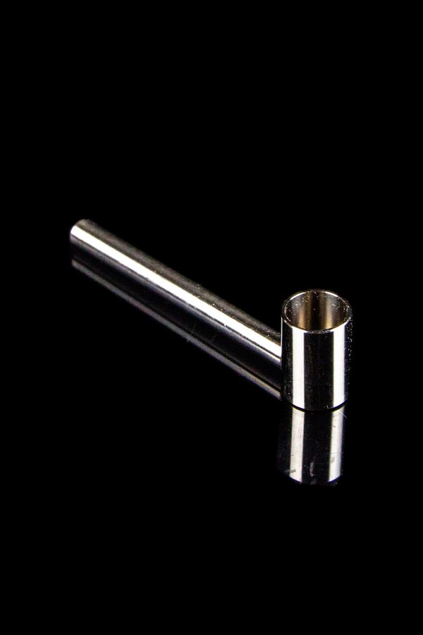 Silver one-hitter pipe against a black background.