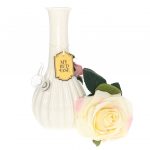 A front view of the My Bud Vase Rose Porcelain Vase Water Pipe, showcasing its delicate, floral design in a studio setting.