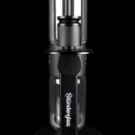 Sündglass black silicone nectar collector with glass tip, isolated on a black background.
