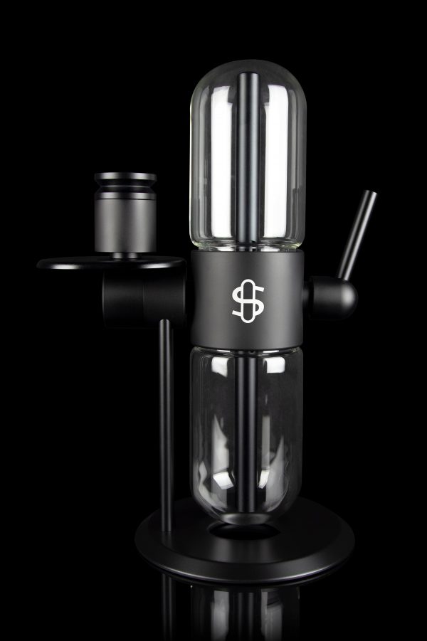 Black glass cannabis rig with a cylindrical percolator chamber and a branded emblem.