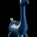 Blue ceramic giraffe-shaped water pipe with gold horns, reflecting on a black surface.