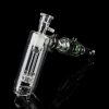 Clear glass bubbler and oil rig with intricate design, isolated on black.