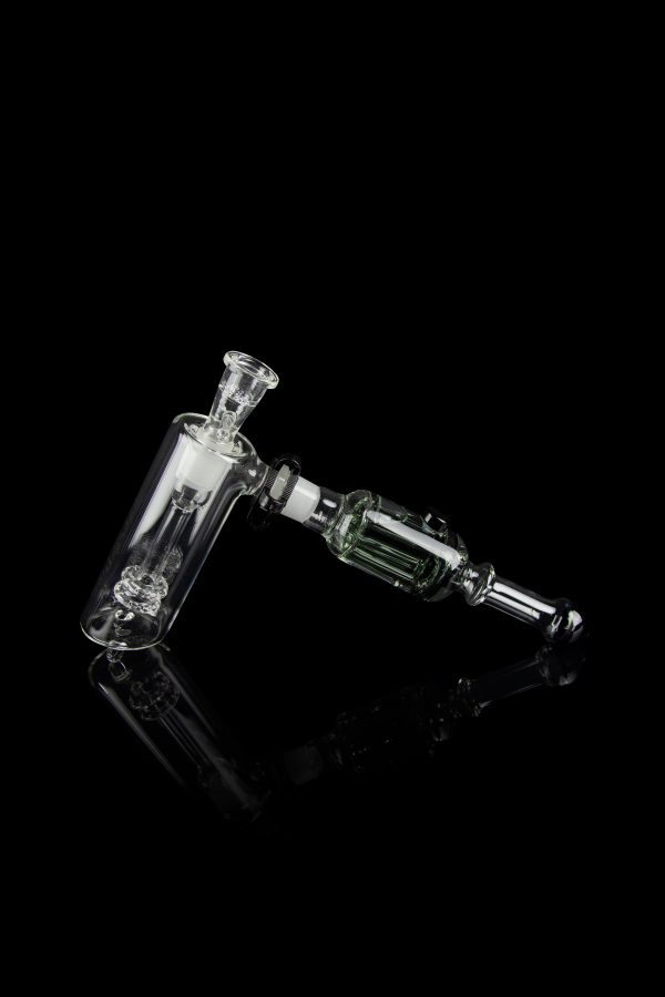 Glass rig with bubbler and connection for dabbing, isolated on black.