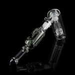 Clear glass oil rig with complex bubbler design, isolated on black.