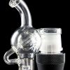 Clear glass water pipe (rig) with a skull-shaped bubbler attached to a black electronic heating device, isolated on a black background.