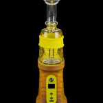 A modern, electronic dab rig with a glass bubbler and amber-colored base, displayed against a black background.