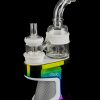 A Daab rig with a glass bubbler and quartz insert, displayed on a colorful reflective base.
