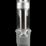 Silver and frosted glass cannabis oil rig with a cylindrical shape and visible internal components, against a black background.