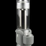 Silver and gray cannabis oil vaporizer with glass chamber, displayed against a black background.
