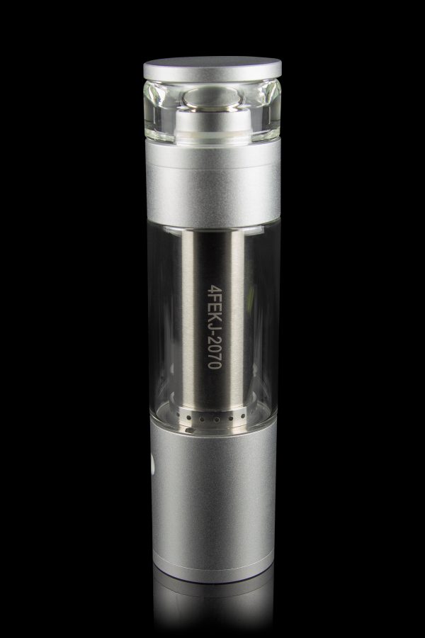 Silver cannabis oil vape pen with a glass mouthpiece and engraved serial number, isolated on black.