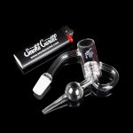 Glass oil rig with accessories and branded packaging.