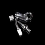 Clear glass dab rig components including a carb cap, banger, and downstem on a black background.