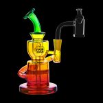 Red glass water pipe with iridescent accents and a quartz dab rig next to it, against a black background.