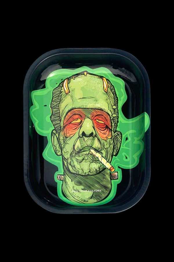 A close-up, overhead view of the “Kill Your Culture “Frankenstoned” Rolling Tray” depicts a Frankenstein-inspired design with vibrant green accents.