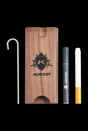 A side view of the Kozo Dugout, showcasing the wooden box with a metal pipe and a partially smoked cigarette visible inside.