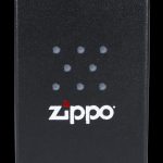 Black Zippo lighter with a constellation of dots and white logo.