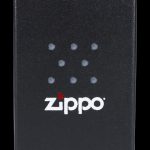Black Zippo lighter with cannabis leaf design.