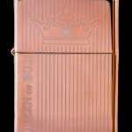 Copper-colored lighter engraved with vertical lines and the phrase “Queen of Bud” with a crown illustration.
