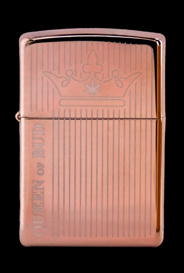 Copper-colored lighter engraved with vertical lines and the phrase “Queen of Bud” with a crown illustration.