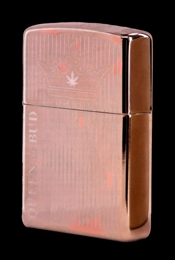 Copper-colored lighter engraved with a cannabis leaf and the text “OTTEN & BUD”.