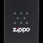 Black Zippo lighter with a cannabis leaf design.