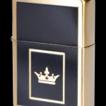 Gold lighter with a cannabis leaf crown emblem on a black inset.