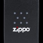 Black Zippo box with a cannabis leaf pattern and logo.