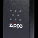 Black Zippo lighter with cannabis leaf pattern.