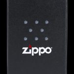 Black Zippo lighter with cannabis leaf design.