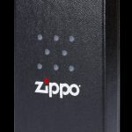 Black Zippo lighter with cannabis leaf pattern.