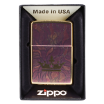 Zippo lighter with a purple and gold cannabis leaf design in its packaging.
