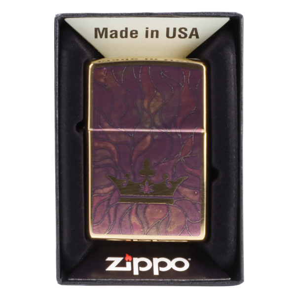 Zippo lighter with a purple and gold cannabis leaf design in its packaging.
