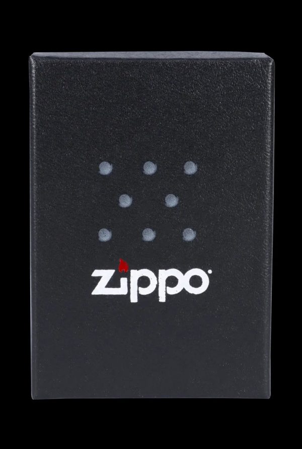 Black Zippo lighter box with cannabis leaf-shaped dots and logo.