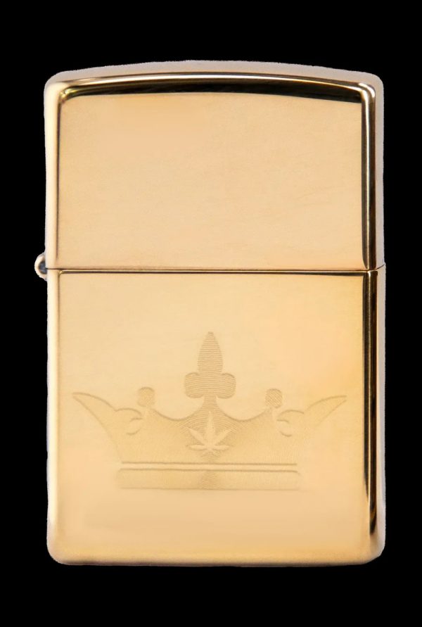 Gold Zippo lighter engraved with a spade suit playing card.