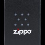 Black Zippo lighter box with cannabis leaf pattern.
