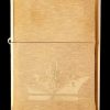 Gold Zippo lighter engraved with a cannabis flower design.