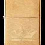 Gold Zippo lighter engraved with a cannabis flower design.