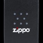 Black Zippo lighter with cannabis leaf design.