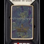 Zippo lighter with a cannabis leaf and forest design in a presentation box.