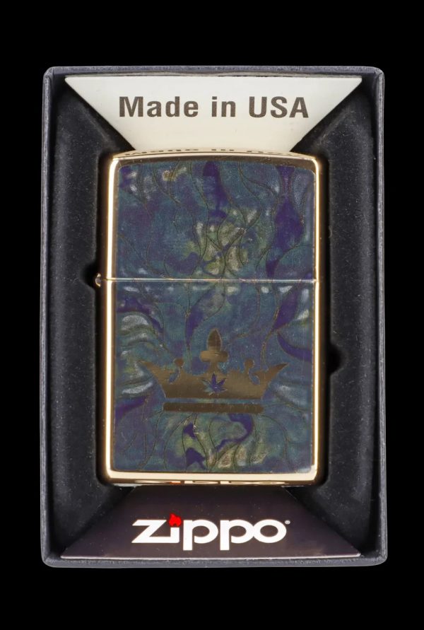 Zippo lighter with a cannabis leaf and forest design in a presentation box.