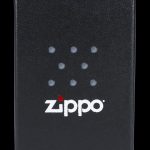 Black Zippo lighter with cannabis leaf pattern.