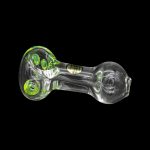 Clear glass pipe with green accents, isolated on black.