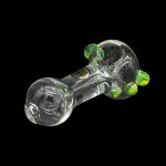 Glass cannabis pipe with green accents, isolated on a black background.
