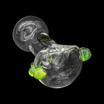 Glass cannabis water pipe with green accents against a black background.