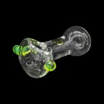 Green and clear glass cannabis pipe with swirling patterns, isolated on a black background.