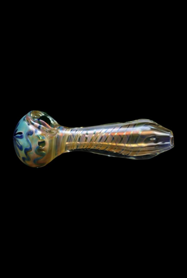 Glass pipe with colorful swirls against a black background.