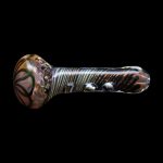 Hand-blown glass pipe with swirling orange, black, and iridescent patterns.