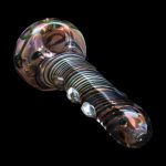 Hand-blown glass pipe with colorful swirls and raised bubbles, isolated on black.