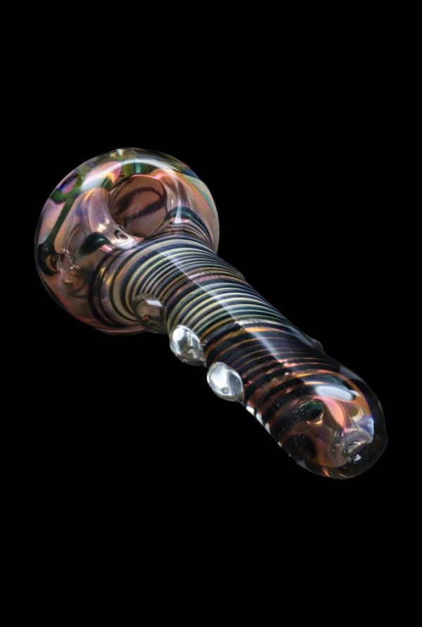 Hand-blown glass pipe with colorful swirls and raised bubbles, isolated on black.