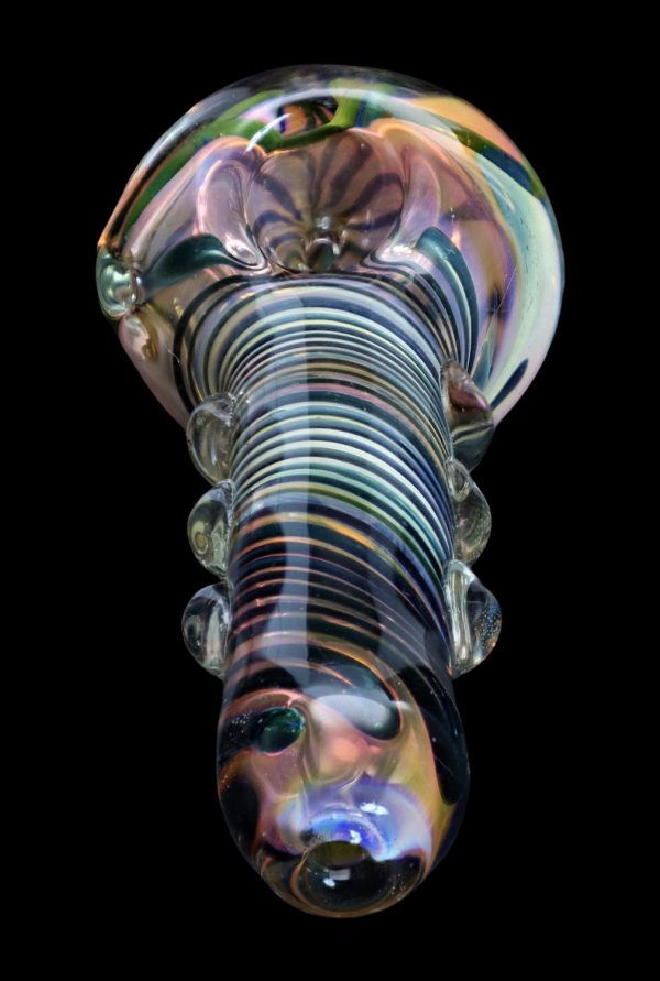 Colorful glass pipe with swirling patterns, isolated on a black background.